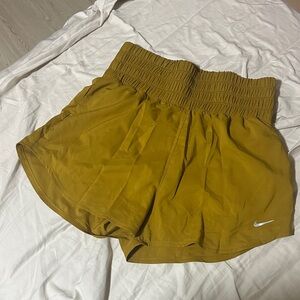 Nike Women’s High-Waist Athletic Shorts in Mustard